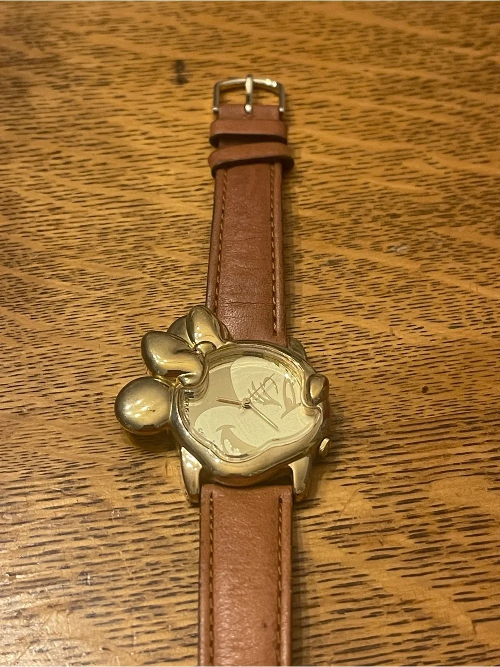 Vintage Lorus Minnie Mouse character watch featuring a distinct gold-tone Minnie